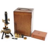 W Watson & Sons of High Holborn London, 19th century lacquered adjustable microscope with mahogany