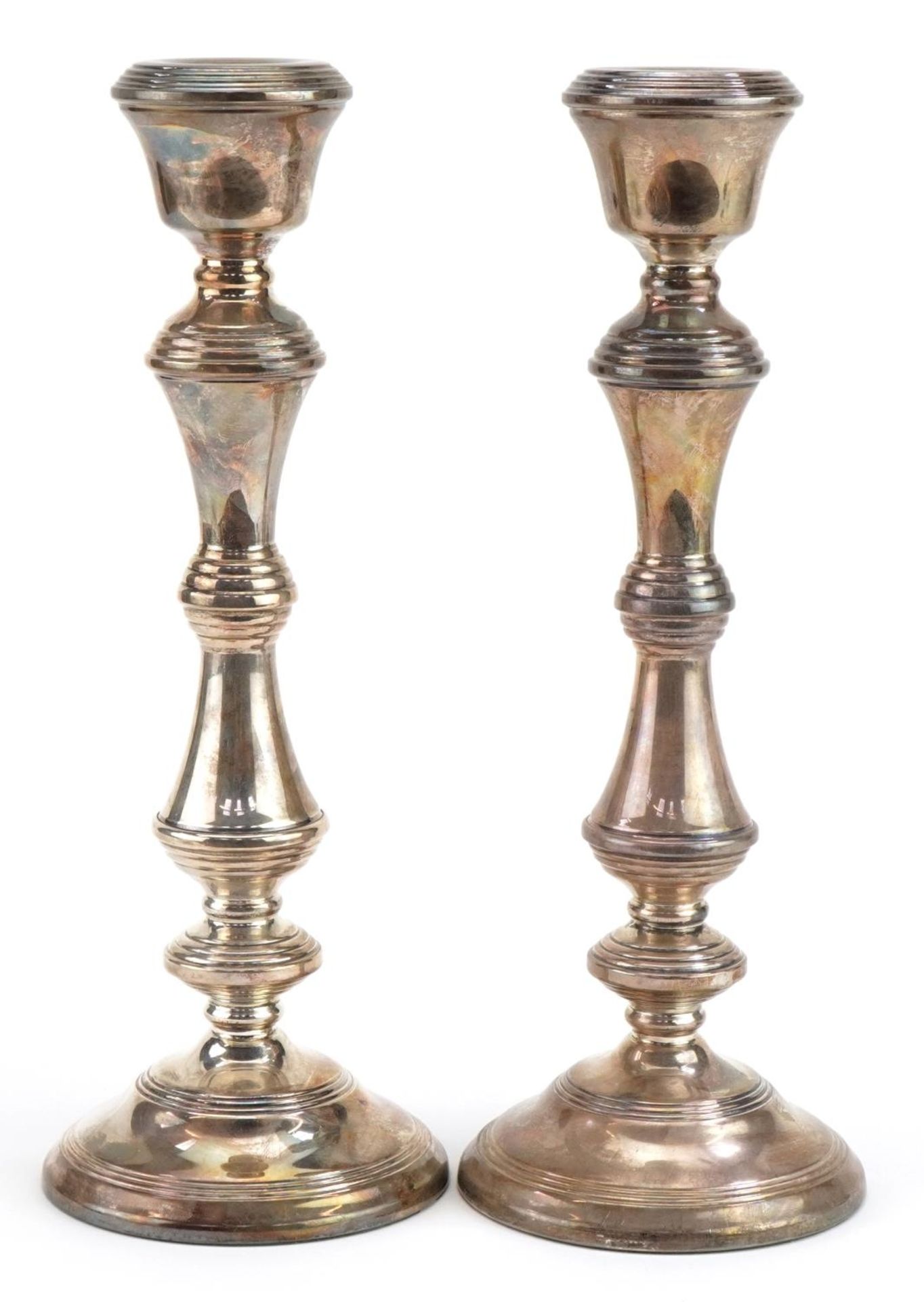 W I Broadway & Co, large pair of Elizabeth II silver filled candlesticks, one with British Petroleum