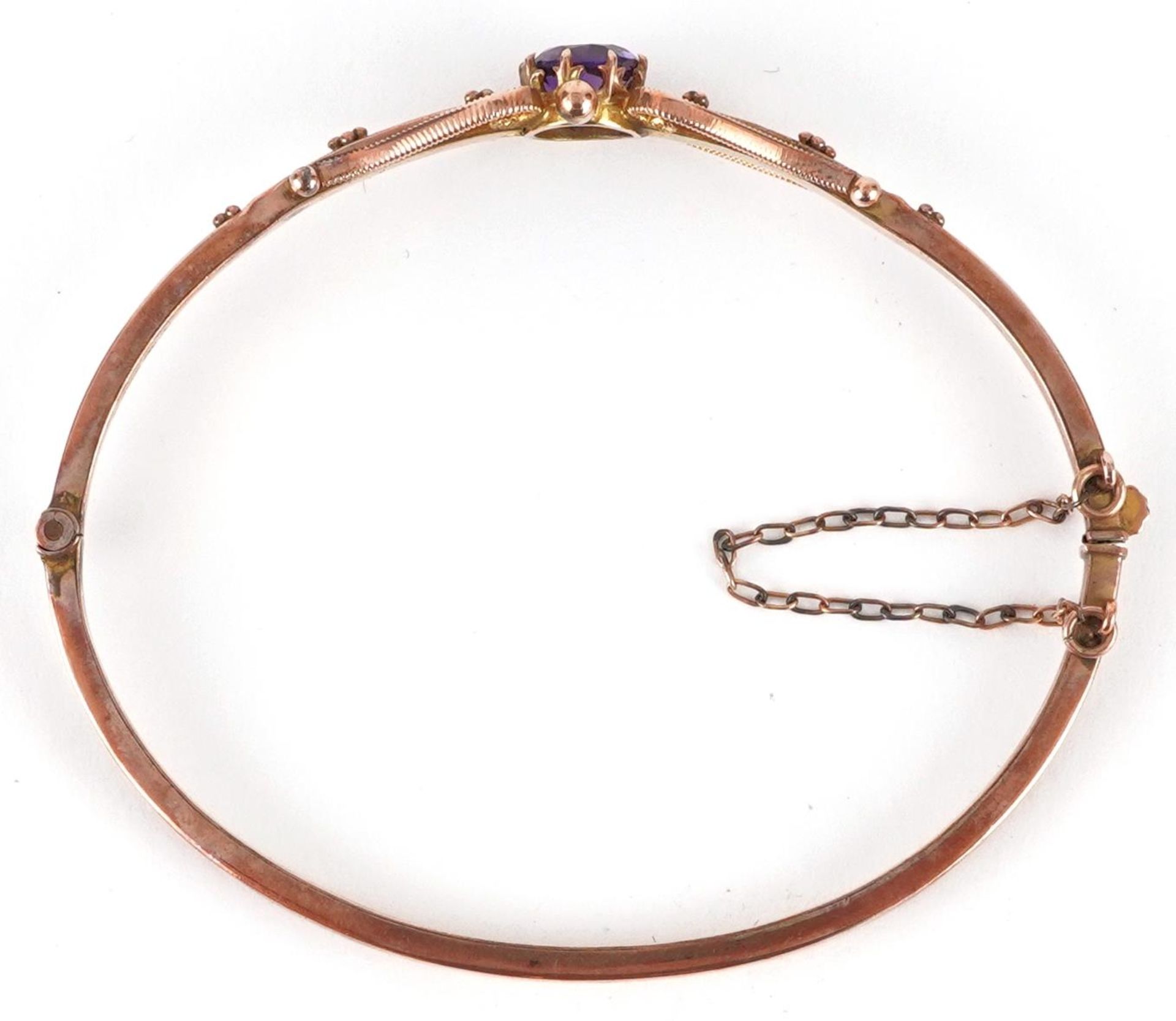 Edwardian 9ct rose gold amethyst bangle with scrolled decoration, the amethyst approximately 6.6mm - Image 3 of 4