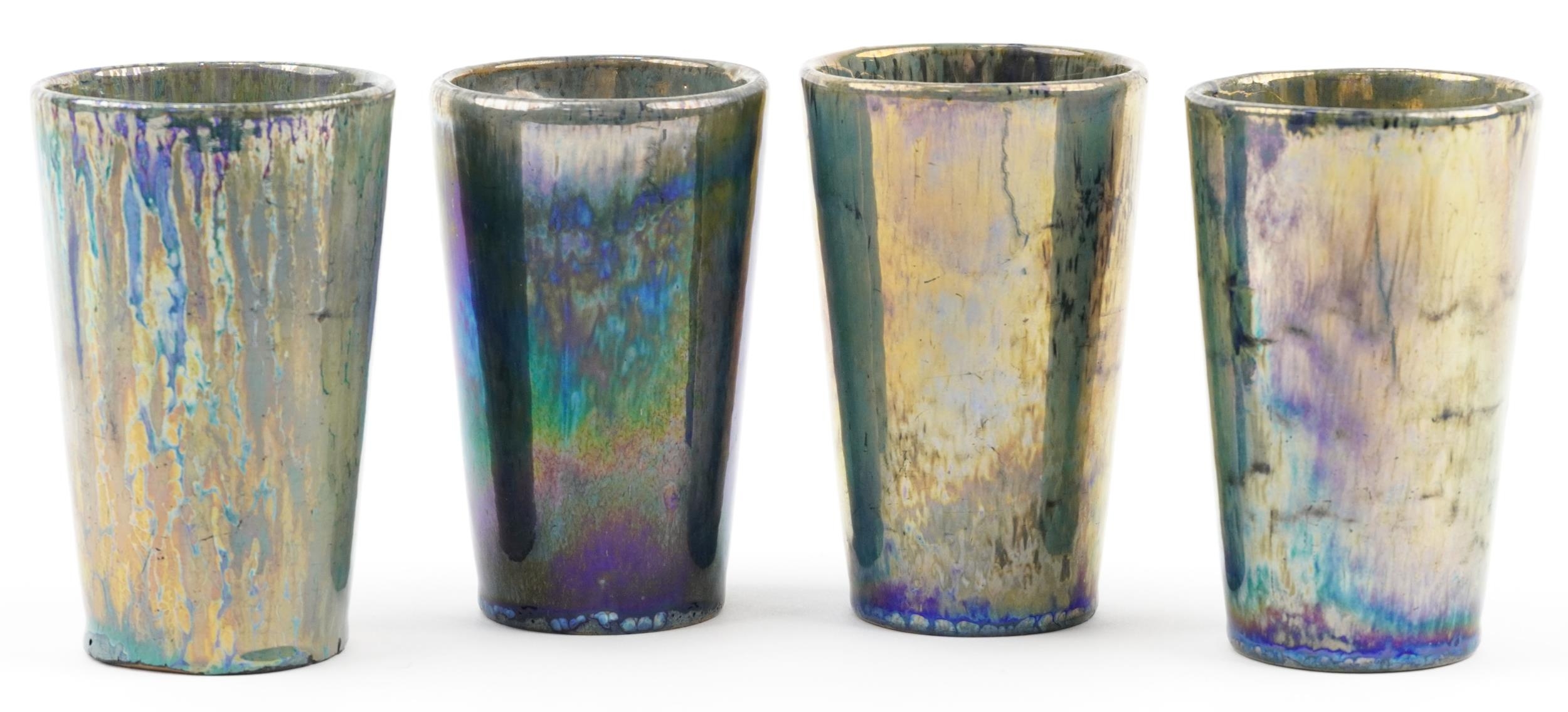 Alphonse Cytere-Rambervillers, set of four French pottery beakers having iridescent green and blue