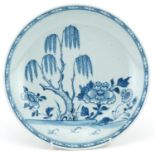 Chinese blue and white porcelain shallow dish hand painted with a pine tree and flowers, 22cm in