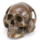 Novelty bronze model of a skull wearing headphones, 14.5cm high : For further information on this