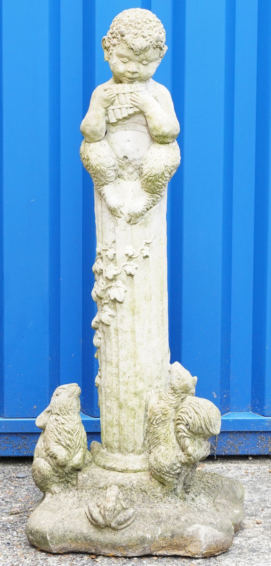 Garden stoneware statue of a faun seated on a column with animals at the base, 86cm high : For