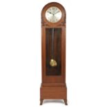 Art Deco oak grandfather clock with silvered dial having Arabic numerals and bevelled glass panel,