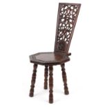 Victorian oak spinning chair deeply carved and pierced with flowers and foliage, 95.5cm high : For