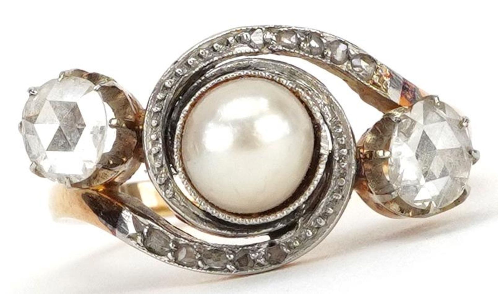 Unmarked gold cultured pearl and diamond three stone ring with diamond crossover shoulders, tests as