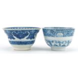 Two Chinese blue and white porcelain bowls, each finely hand painted with flowers, one with Kangxi