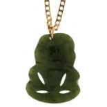 Carved spinach jade tiki pendant on 9ct gold curb link necklace, 3.0cm high and 45.5cm in length,