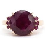 10k gold ruby seven stone ring, the largest ruby approximately 12mm in diameter, size P, 4.8g :