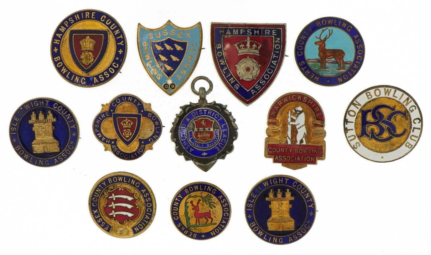 Bowling enamel pin badges and a silver and enamel jewel including Sussex Bowling Association and