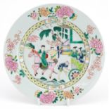 Chinese porcelain plate hand painted in the famille rose palette with figure on horseback in a