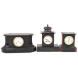 Three Victorian black slate mantle clocks including two with marble, each having enamelled dial, one