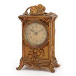 Art Nouveau gilt metal mantle clock with circular dial having Arabic numerals, 14cm high : For