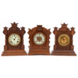 Three American Ansonia Clock Co mantle clocks with Roman and Arabic numerals, the largest 38.5cm