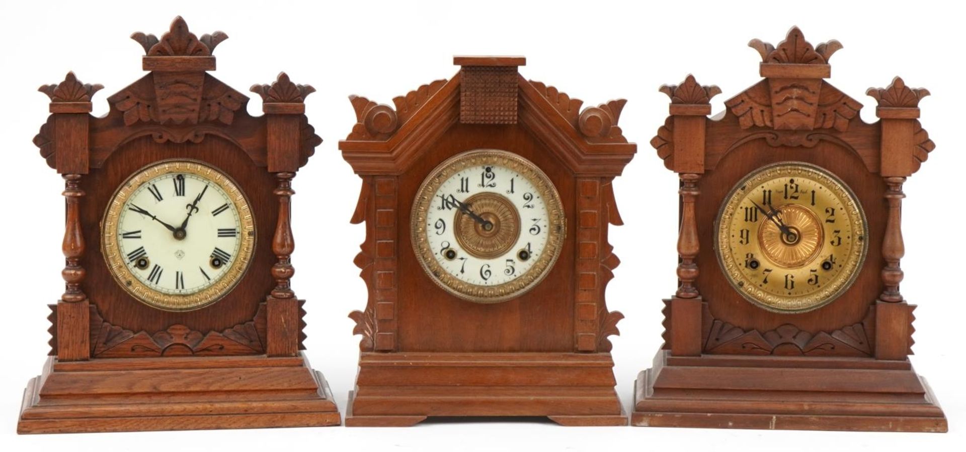 Three American Ansonia Clock Co mantle clocks with Roman and Arabic numerals, the largest 38.5cm