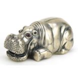 Silver model of a recumbent hippopotamus paperweight with ruby eyes, impressed Russian marks, 8.