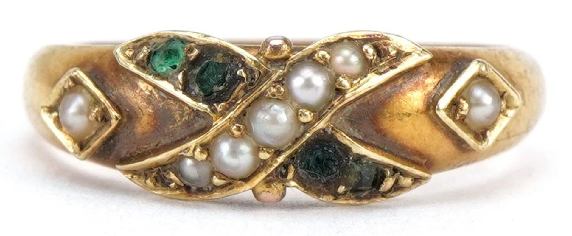 Victorian 15ct gold seed pearl and green stone crossover ring, London 1874, housed in a Harrods,