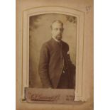 Victorian cartes de visite photographs arranged in an album including children and females wearing