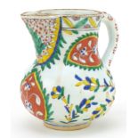 Turkish Ottoman Kutahya pottery handled jug hand painted with stylised flowers, 12.5cm high : For
