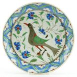 Turkish Iznik shallow dish hand painted with a stylised bird amongst flowers, 29.5cm in diameter :