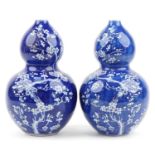 Pair of Chinese blue and white porcelain double gourd vases hand painted with prunus flowers, blue