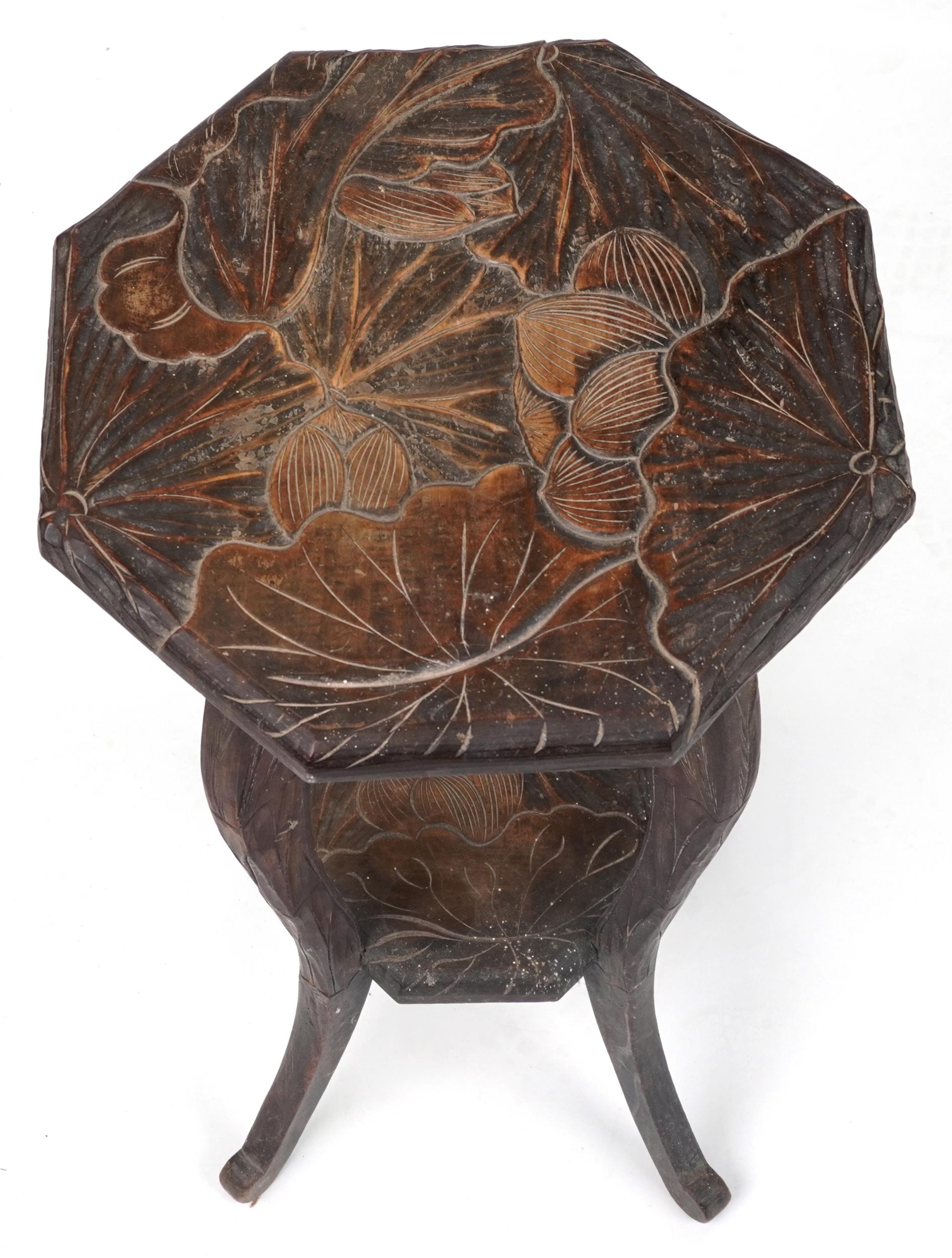 Manner of Liberty & Co, Japanese hardwood side table carved with flowers, 76cm high x 43cm in - Image 2 of 3