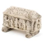 Roman or medieval style model of a lidded coffin on stand decorated in relief with figures and