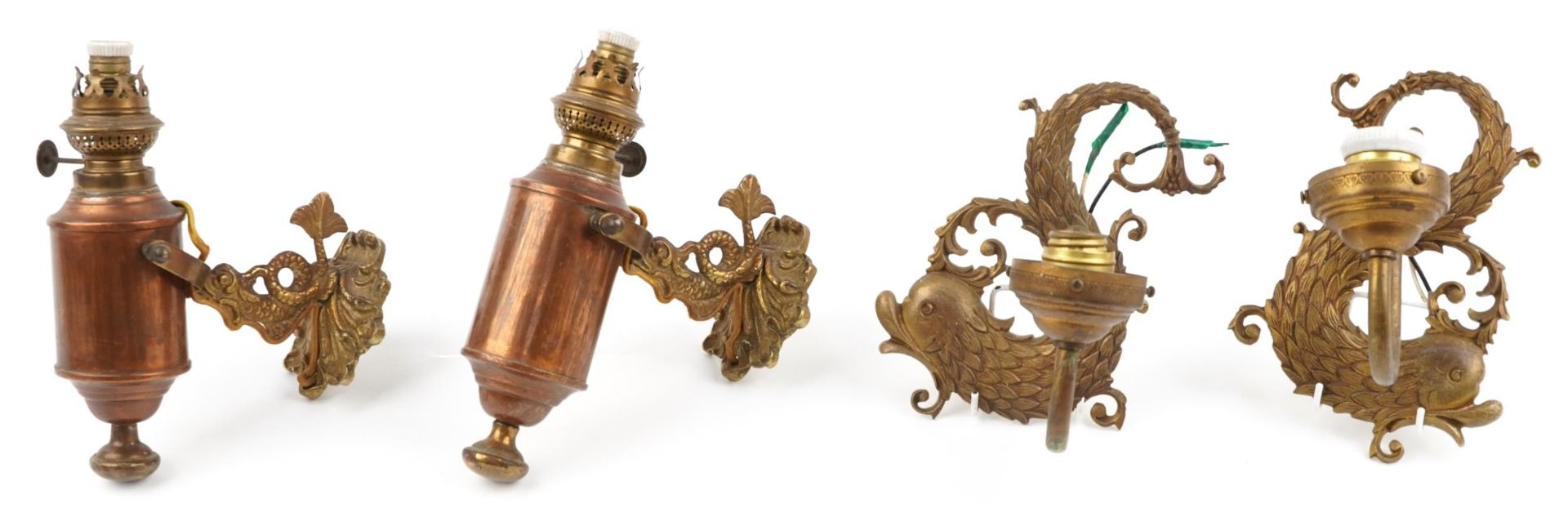 Two pairs of 19th century style brass seahorse design wall sconces including a pair with copper
