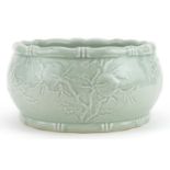 Chinese porcelain celadon glazed bowl with faux bamboo borders decorated in low relief with peach