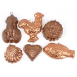 Six copper jelly moulds including fish and shell design examples, the largest 28cm in length : For