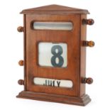 Large early 20th century oak perpetual desk perpetual roller calendar, label to the reverse, 32cm
