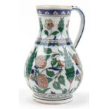 Turkish Iznik pottery handled jug hand painted with stylised flowers, 25cm high : For further