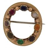 Antique unmarked gold multi gem wreath brooch set with various stones including sapphire, ruby,