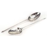 Two 18th century silver mote spoons, each with pierced scroll decoration to the bowls, each