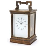 Matthew Norman, large brass cased carriage clock with reeded columns and enamelled dial having Roman
