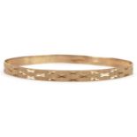 9ct gold engine turned bangle, 7cm in diameter, 6.8g : For further information on this lot please