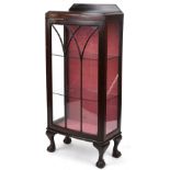 Mahogany bow front display cabinet enclosing two glass shelves on claw and ball feet, 127cm H x 56cm