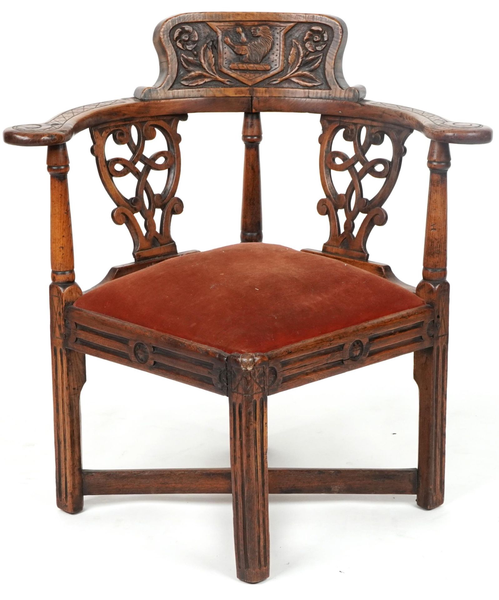 19th century country style corner chair carved with lion crest and flowers, 80cm high : For