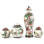 Chinese crackle glaze porcelain hand painted with warriors comprising a baluster vase with cover and