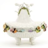 Italian floral encrusted porcelain four footed centre bowl and cover with Putti finial, 30cm