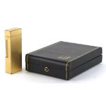 Dunhill gold plated pocket lighter together with a fitted Dunhill case : For further information