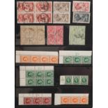 British George V stamps arranged in an album including Seahorses up to ten shillings, blocks and