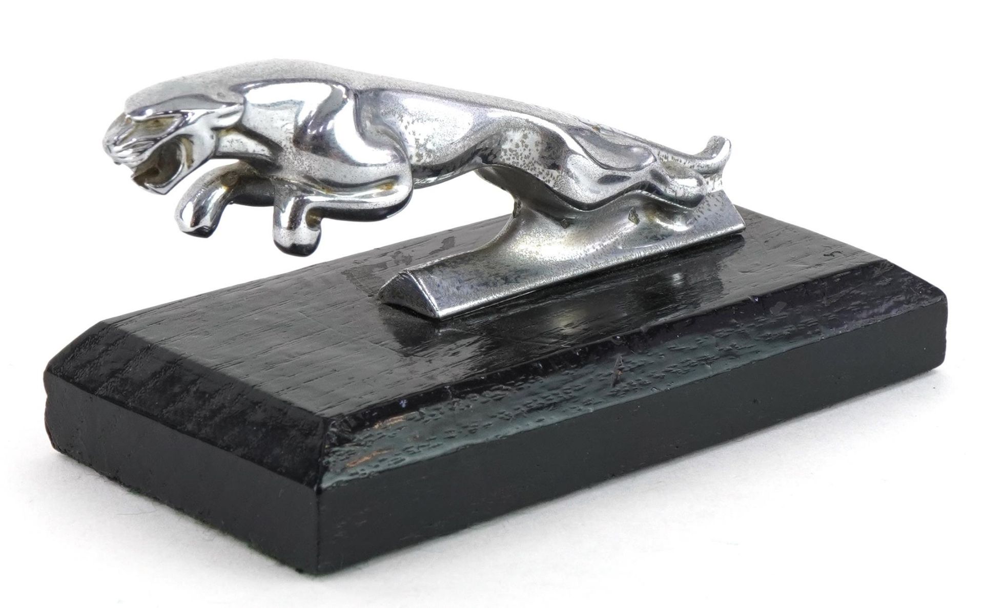 Vintage chrome plated Jaguar car mascot on wooden plinth base, 14cm in length : For further