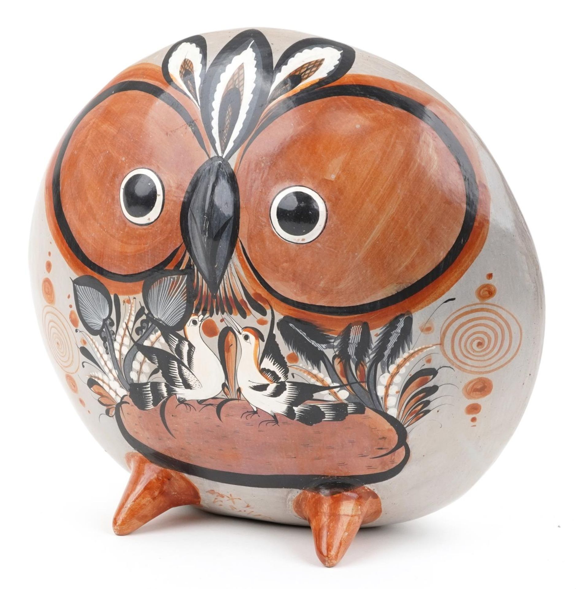 Mid century style South American terracotta sculpture in the form of a stylised owl hand painted