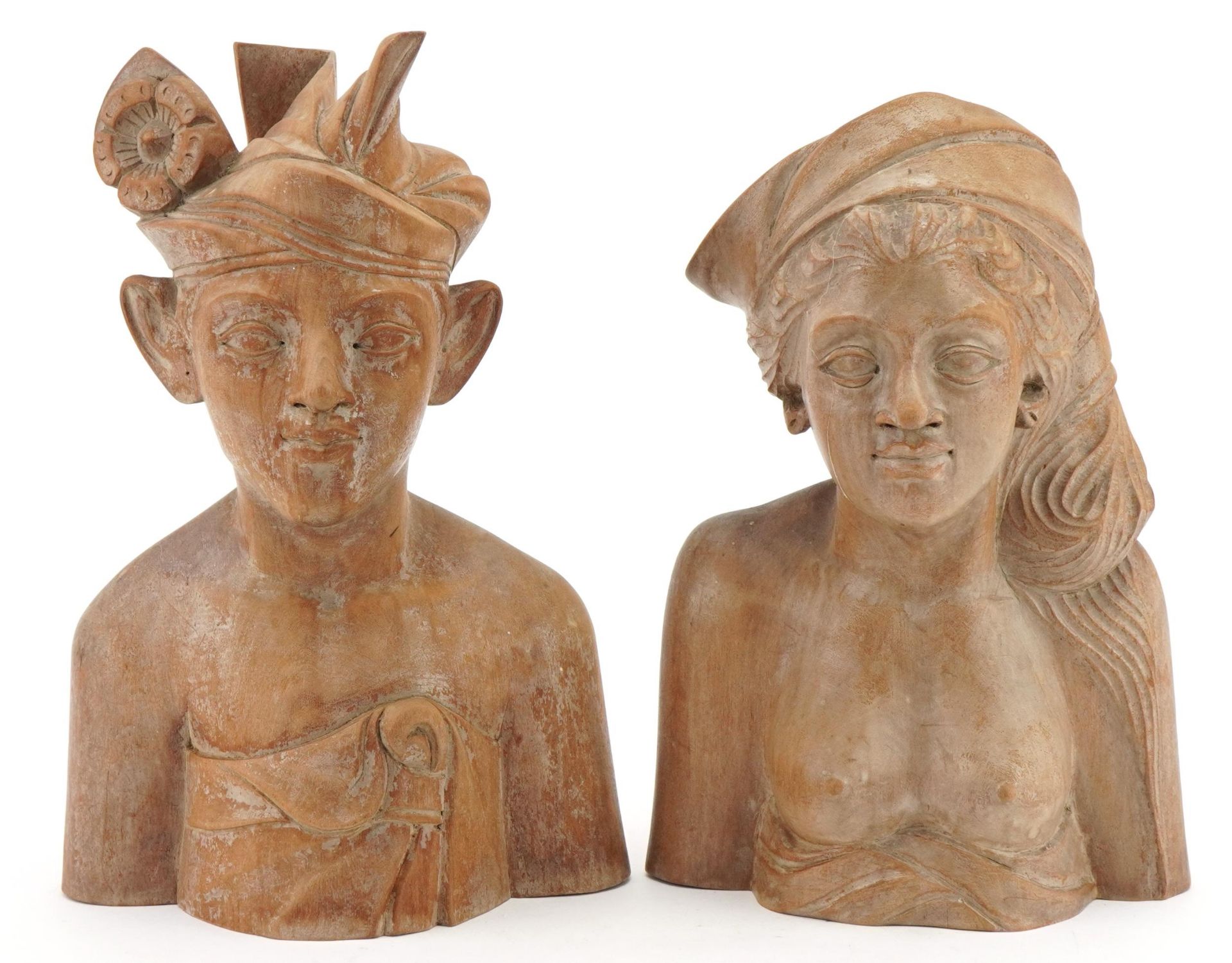 Two Balinese carved wood busts, the largest 24cm high : For further information on this lot please