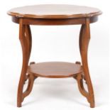 Mahogany centre table with serpentine outline and under tier, 62cm high x 67cm in diameter : For