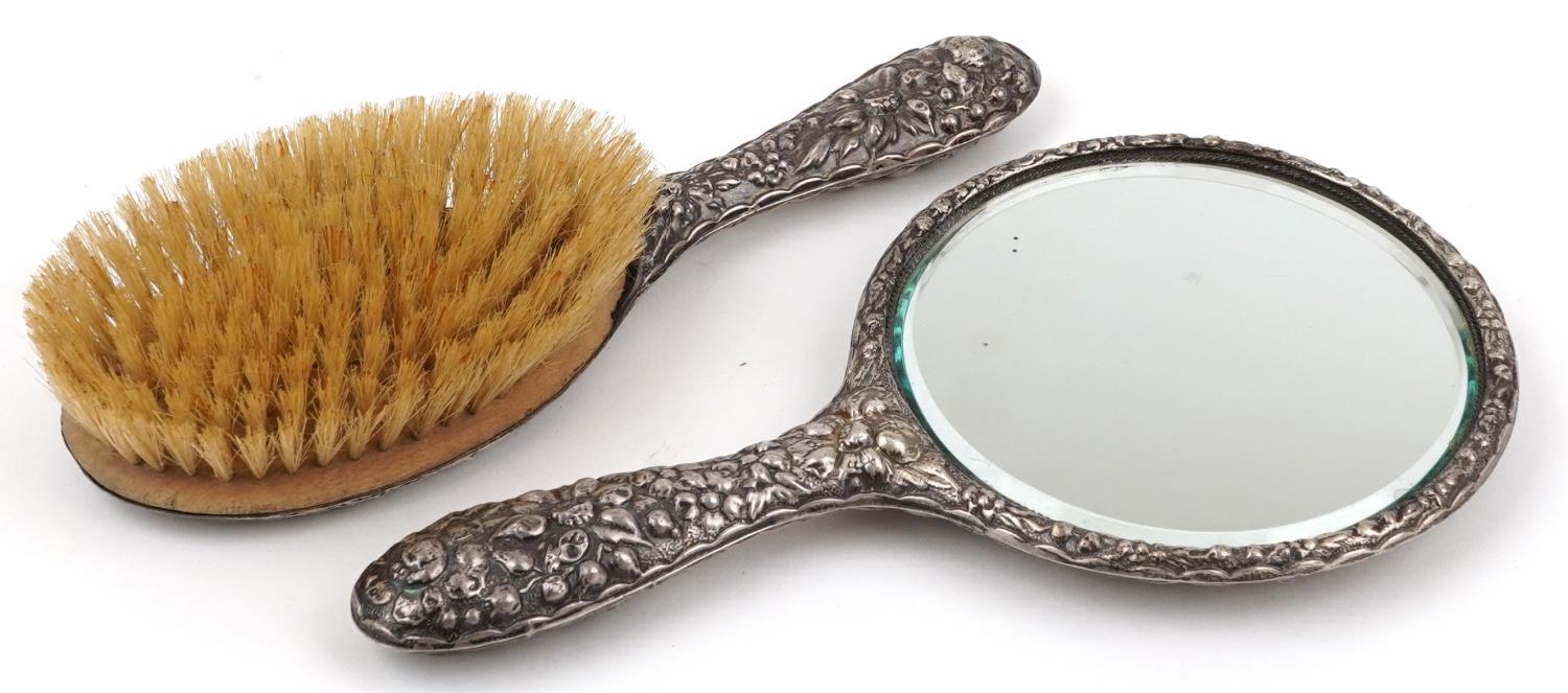 Silver backed hand mirror and clothes brush profusely embossed with flowers and foliage, S M maker's - Image 2 of 3
