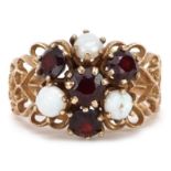 9ct gold garnet and cabochon opal flower head ring with pierced shoulders, size M, 4.7g : For