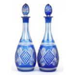 Pair of Bohemian blue overlaid cut glass decanters, each 36cm high : For further information on this