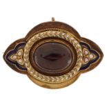 Victorian unmarked gold cabochon garnet and enamel mourning brooch, tests as 9ct gold, 4.5cm wide,